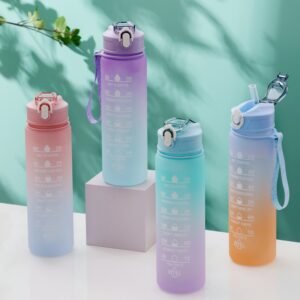 Assorted gradient sports water bottles with straw lids and hydration markings