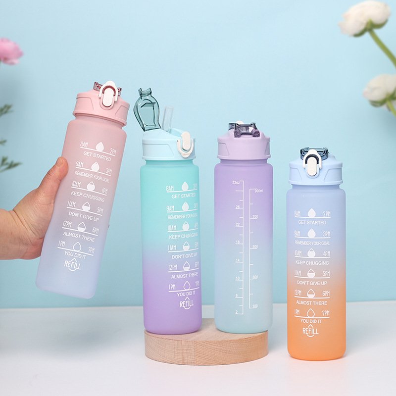 Gradient water bottles showing time and volume markings