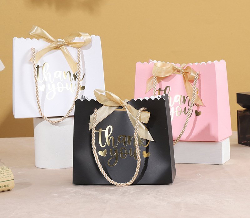 Bow-Decorated Paper Gift Bag for Favors and Candy detail image 4