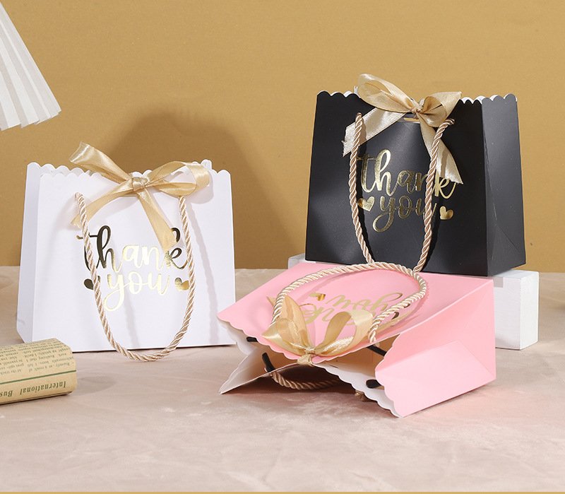 Bow-Decorated Paper Gift Bag for Favors and Candy detail image 5